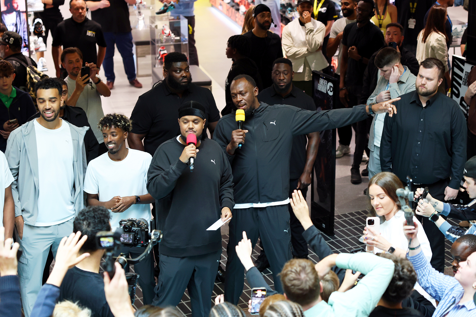 Usain Bolt and Chunkz at the opening of a JD Sports store.