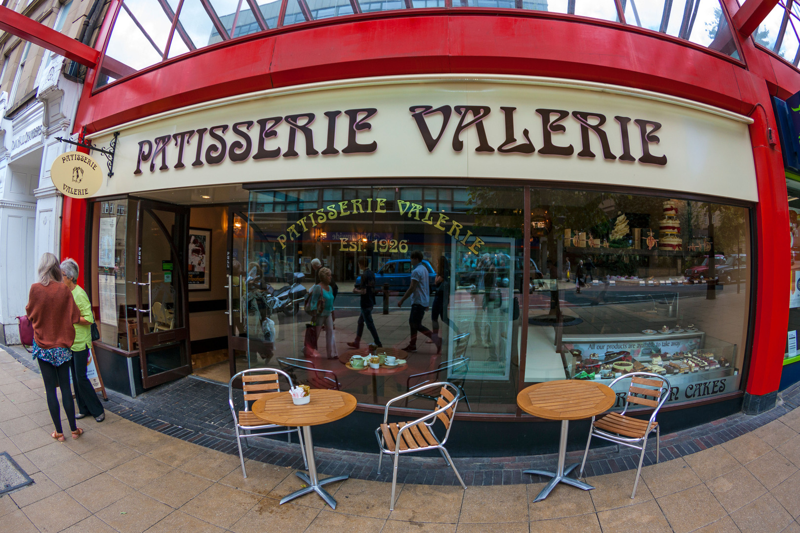 Patisserie Valerie storefront with outdoor seating.