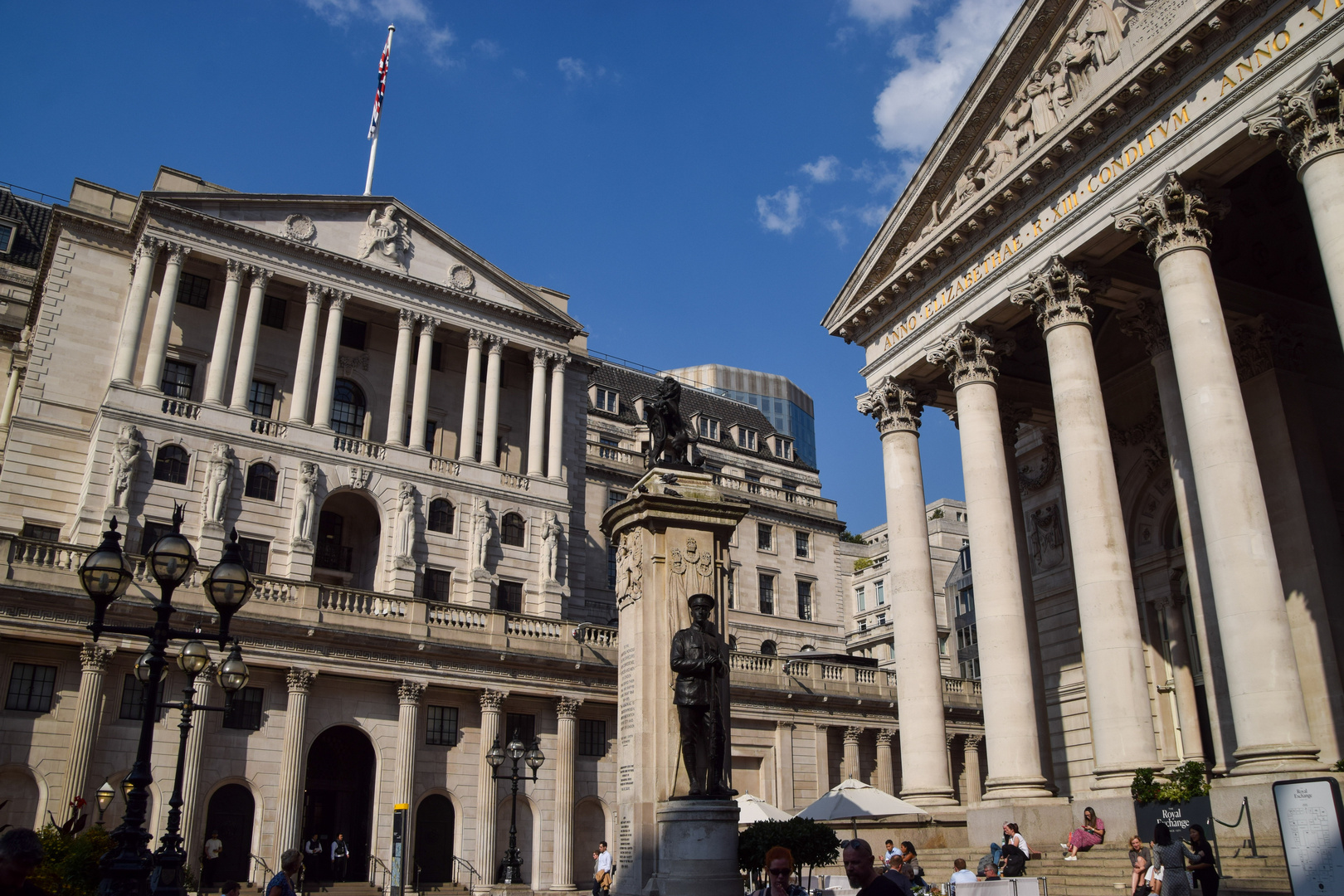 The Bank of England building and a nearby war memorial.